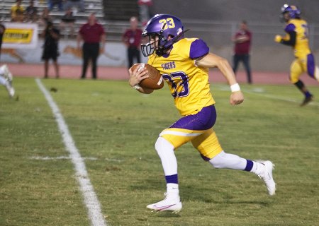 On a bad snap, Lemoore kicker Jayden Evangelo took a bad snap and ran for a first down against Clovis West.
